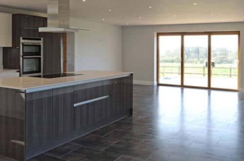 large open plan kitchen with patio doors