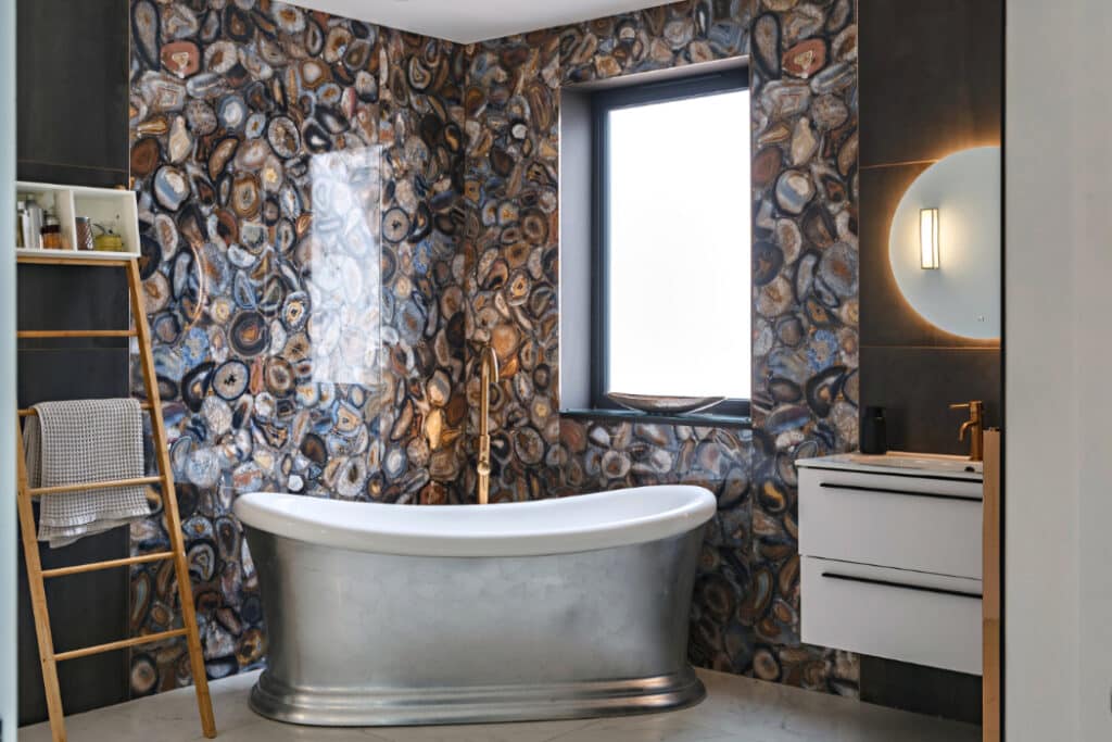 The bathroom features a stunning wall effect