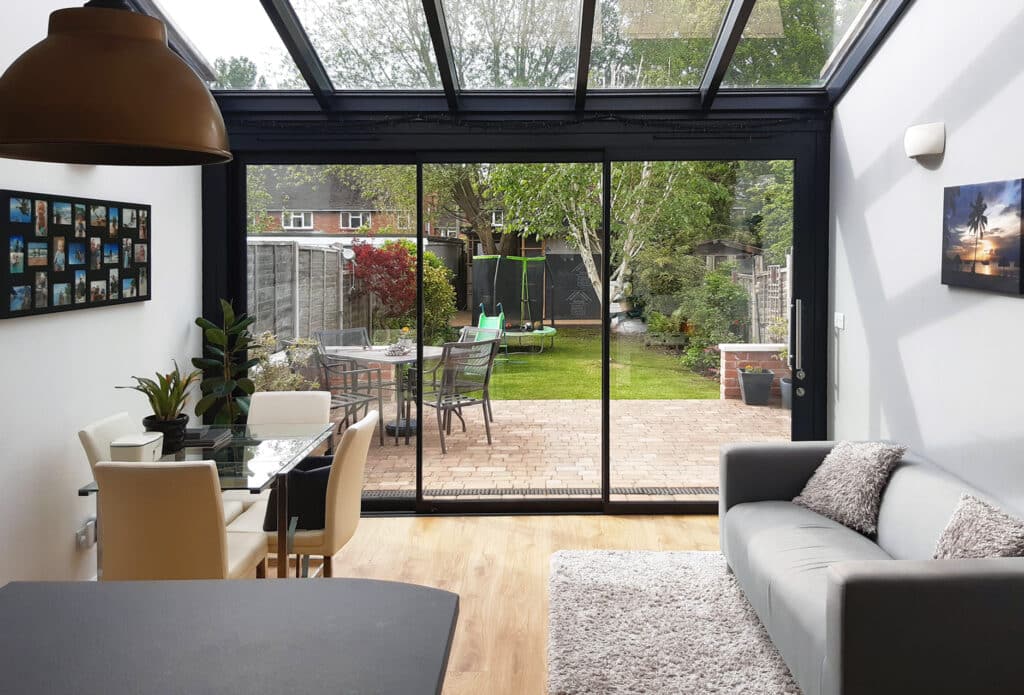 Glass extension with sliding doors