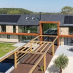 Thumbnail of http://Exterior%20shot%20of%20the%20rear%20of%20the%20Lincolnshire%20Grand%20Designs%20project%20featuring%20SVG20%20sliding%20doors,%20SF75eco%20bifold%20doors,%20aluminium%20windows%20and%20large%20fixed%20frame%20picture%20window