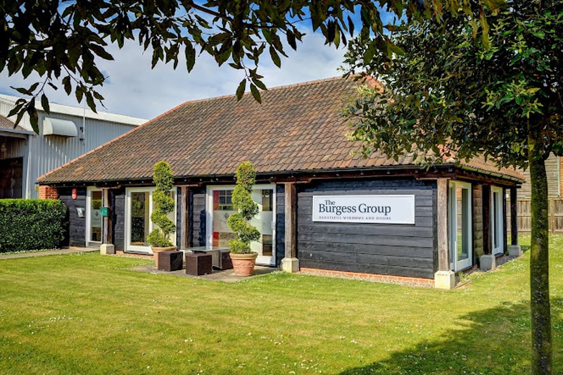 The Burgess Group showroom in Bury displaying bifold doors and sliding doors with dark frames and glazing systems