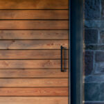 Thumbnail of http://Rescobie%20Pavilion%20detail%20showing%20wooden%20cladding%20and%20dark%20framed%20glazing%20system%20meeting%20stone%20masonry.